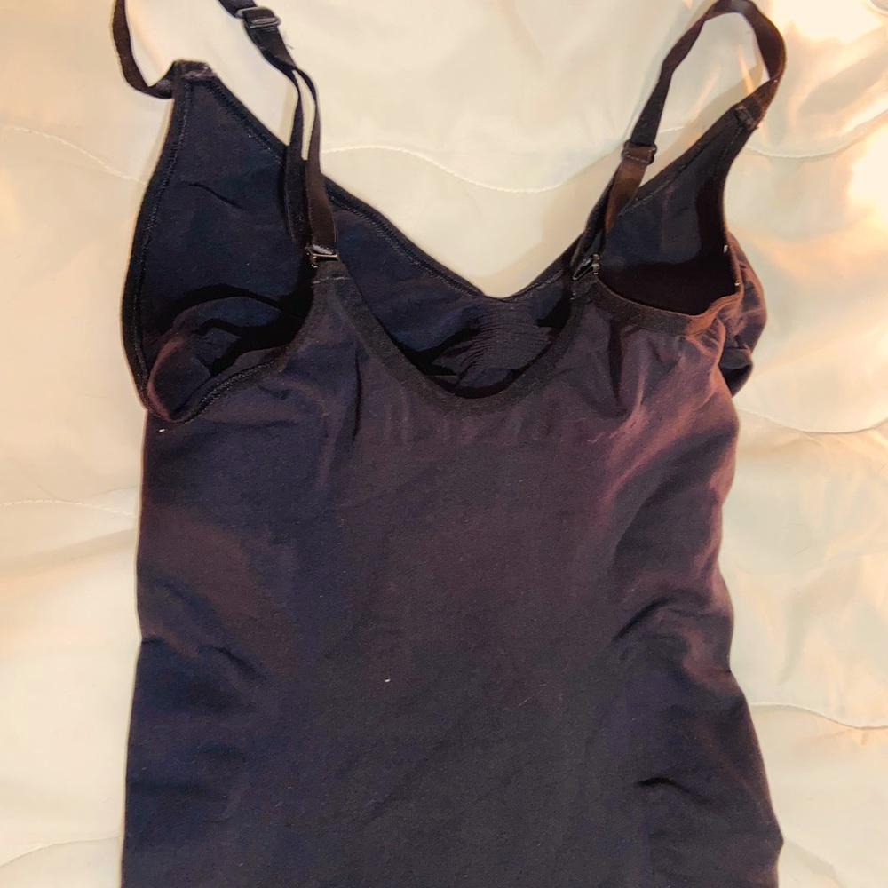 SKIMS body suit med thigh. Out of package, never worn, never tired on.